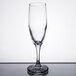 A Libbey Embassy flute glass with a small rim on top.