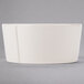 A Libbey round cream porcelain oatmeal bowl with a curved edge on a gray background.