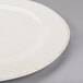 A white Libbey porcelain plate with a medium rim.