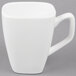 A close-up of a Libbey Ultra Bright White Tall Porcelain Cup with a white handle.