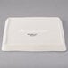 A white square Libbey porcelain tray.