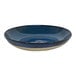 A blue bowl with a white rim.