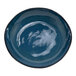 A round indigo porcelain bowl with a black rim.