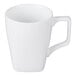 A white porcelain mug with a square handle and a tapered shape.
