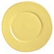 A close up of a Libbey Farmhouse yellow porcelain plate with a rim.