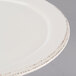 A close up of a white Libbey Farmhouse porcelain plate with a medium rim.