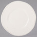 A white Libbey round porcelain plate with a wide rim.