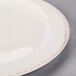 A white Libbey porcelain plate with a brown rim.