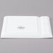 A white rectangular porcelain cocktail plate with 2 compartments and a logo on it.