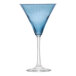 A close-up of a Libbey blue martini glass with a long stem.