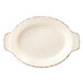 A white oval plate with brown trim.