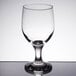 A close-up of a Libbey Embassy clear wine goblet with a reflection.