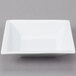 A Libbey white square bowl on a gray background.