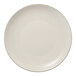 A white Libbey Farmhouse Coupe porcelain plate with a brown speckled rim.