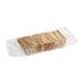 A plastic container of Clown Everything-Seasoned Flatbread Crackers.