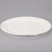 A white oval Libbey porcelain platter with a rim.