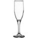 A clear Libbey Embassy flute glass with a long stem.