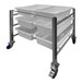 A stainless steel SSL Industries side-by-side tote cart with six lugs holding three trays.