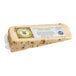 A wedge of Sartori Rosemary and Olive Oil Asiago cheese on a counter.