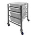 A stainless steel SSL Industries side-by-side tote cart with three white trays on wheels.
