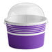 A purple and white paper container with a clear dome lid.