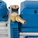 A close-up of a blue and gold VacPak-It vacuum pump.