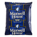 A blue and white Maxwell House Master Blend ground coffee packet.