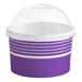 A purple and white paper Choice frozen yogurt cup with a clear dome lid.