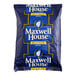 A blue Maxwell House coffee bag with white text.