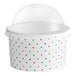 A white container with colorful polka dots on it.