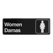 A black and white Lavex Women's / Damas restroom sign with white text.