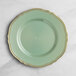 A Visions eucalyptus green plastic plate with gold vintage trim.