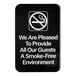 A Lavex black sign with white text that says "We Are Pleased To Provide All Our Guests A Smoke-Free Environment"