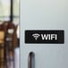 A door with a Lavex black and white sign that says "WiFi"