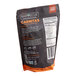 A black Barvecue bag of plant-based wood-smoked carnitas with white and orange text.