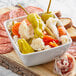 A white bowl of Del Destino Giardiniera on a table.