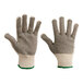 A close-up of a Lavex work glove with two-sided PVC dotted coating. One side has white dots and the other side has green dots.