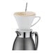 A Cilio stainless steel coffee carafe with a white cup and a filter.