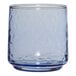 A clear glass Anchor Hocking Brockhill Coastal Blue rocks glass with a blue rim.