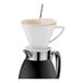 A Cilio stainless steel coffee carafe with a white cup on top.