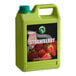 A green Possmei container of strawberry syrup with a label.