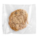 An individually wrapped Southern Roots vegan oatmeal raisin cookie in a plastic bag.