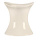 A white bone china egg cup with a curved neck.