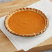 A Southern Roots vegan pumpkin pie on a table.