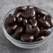 A bowl of Albanese dark chocolate covered cashews.