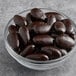 A bowl of Albanese dark chocolate covered almonds.