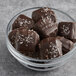 A bowl filled with Albanese dark chocolate covered sea salt caramels.