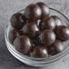 A bowl of Albanese dark chocolate malt balls.