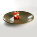 An Elite Global Solutions lizard-colored melamine plate with food on it.