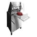 A piece of meat being processed by a Tenderizer Meat machine.